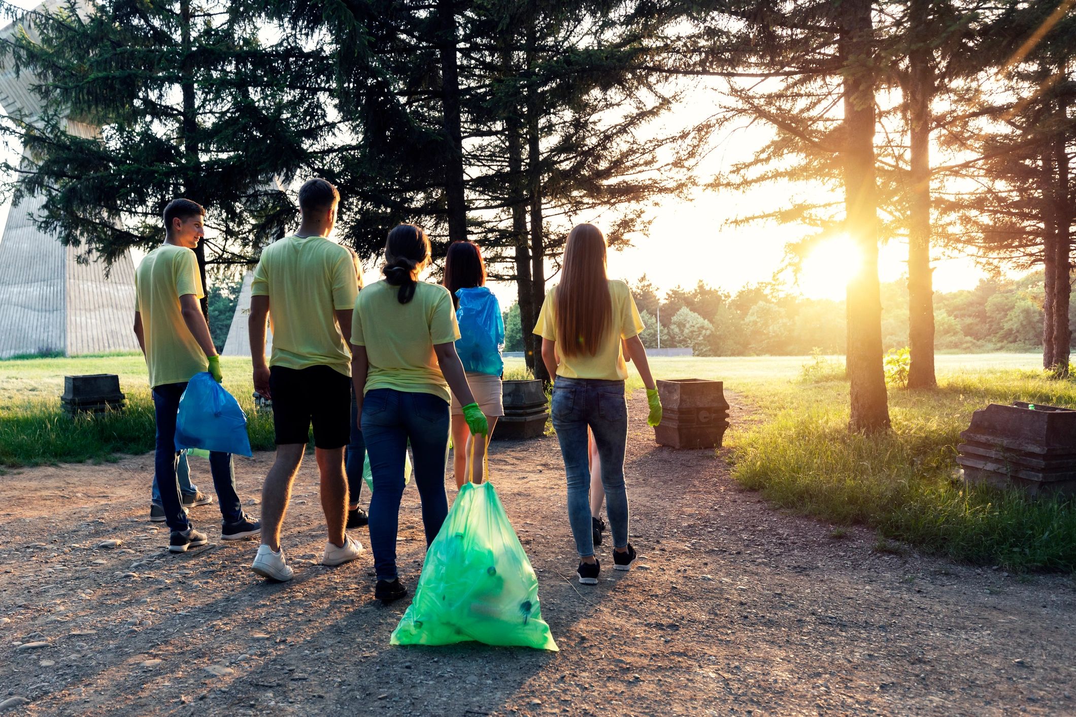 Young volunteers helping care for a public space